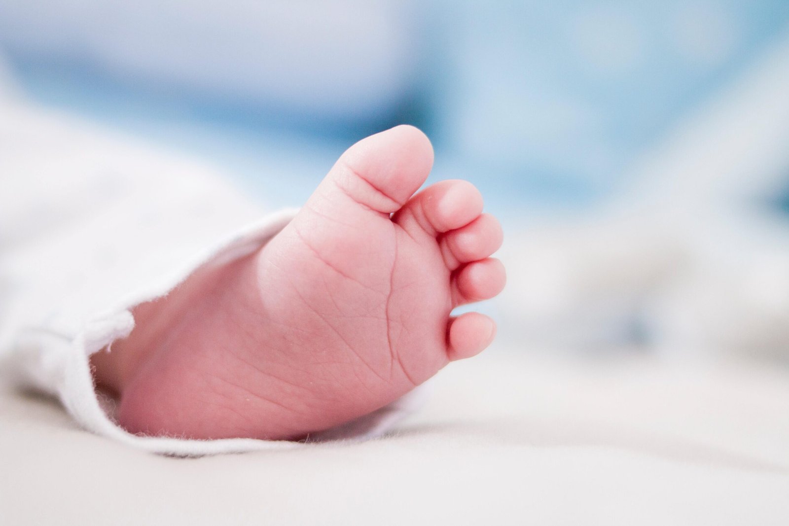 shallow focus shot toe newborn baby